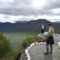 Traveler overlooking Quilotoa crater lake in the Ecuadorian Andes